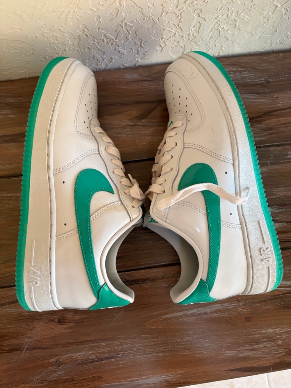 Nike White Low-Top Sneakers with Green Swoosh and Green Outsole